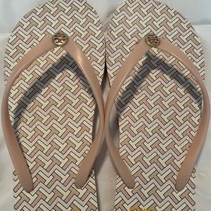 Tory Burch light pink flip flops.
